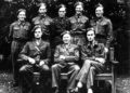 Surrounding their boss Leif Tronstad (front row, center) are most of the Vemork saboteurs, including (front row left to right) Jens Anton Poulsson and Joachim Ronneberg, and (back row left to right) Hans Storhaug, Fredrik Kayser, Kasper Idland, Claus Helberg, and Birger Stromsheim.