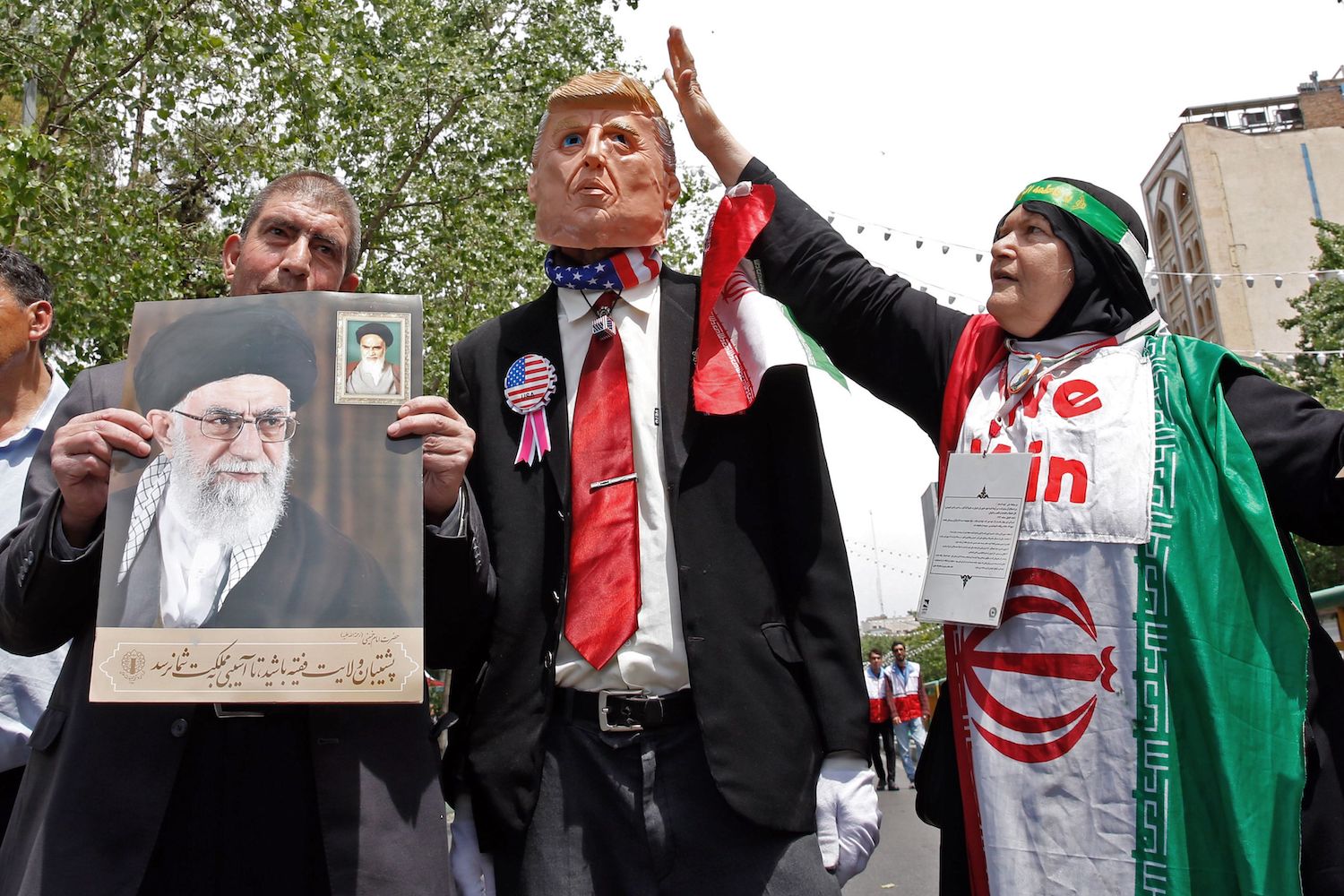 Iranian demonstrators carry a portrait of Iran's Supreme Leader Ayatollah Ali Khamenei and an effigy of US President Donald Trump during a rally in the capital Tehran, on May 10 2019. - Iranian foreign minister blamed the EU for the decline of Tehran's nuclear accord with world powers and insisted the bloc "should uphold" its obligations under the pact in which Iran agreed to curb its nuclear ambitions in return for sanctions relief.
US President Donald Trump pulled the United States out of the agreement in May of last year and reinstated unilateral economic sanctions. (Photo by STR / AFP)        (Photo credit should read STR/AFP/Getty Images)