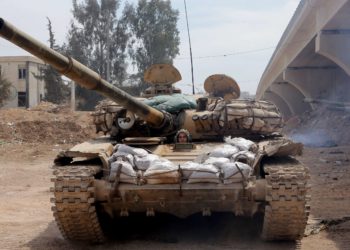 A female Syrian soldier from the Republican Guard commando battalion drives a tank during clashes with rebels in the restive Jobar area, in eastern Damascus, on March 25, 2015. The female battalion, which was created nearly a year ago, consists of 800 female soldiers who are positioned in the suburbs of the Syrian capital where they monitor and secure the frontlines with snipers, rockets and machine guns. AFP PHOTO / JOSEPH EIDJOSEPH EID/AFP/Getty Images