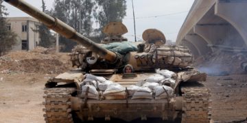 A female Syrian soldier from the Republican Guard commando battalion drives a tank during clashes with rebels in the restive Jobar area, in eastern Damascus, on March 25, 2015. The female battalion, which was created nearly a year ago, consists of 800 female soldiers who are positioned in the suburbs of the Syrian capital where they monitor and secure the frontlines with snipers, rockets and machine guns. AFP PHOTO / JOSEPH EIDJOSEPH EID/AFP/Getty Images