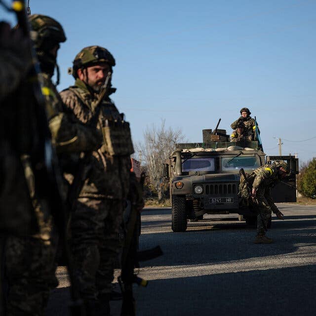 Image of Ukrainian forces welcomed by cheering crowds